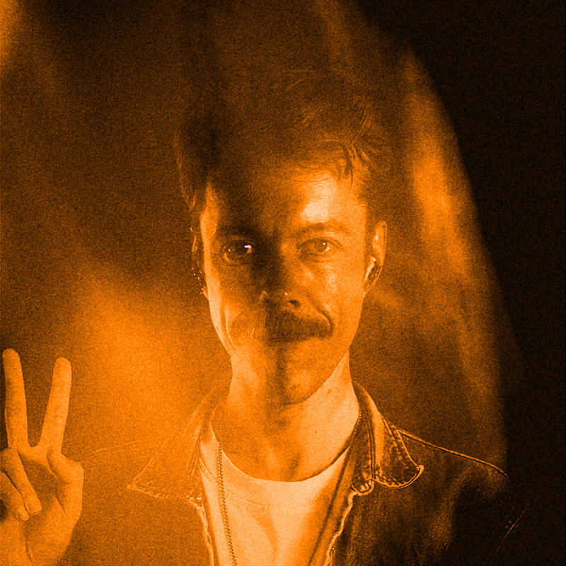 Profile picture of Michiel de Graaf with mustache holding up two fingers making a peace sign